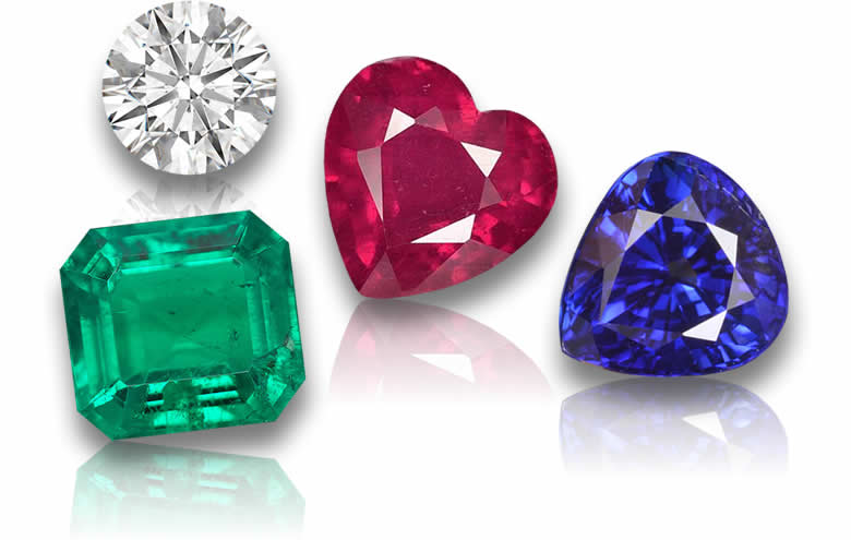 Lose Edelsteine, darunter Rubin, Saphir, Smaragd und Diamant.