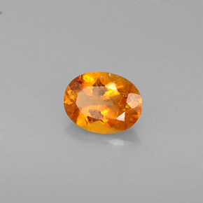 0,57 ctw natürlicher orangefarbener Clinohumit, Oval Schliff, VS-SI