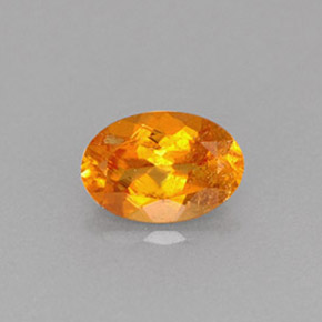 0,61 ctw natürlicher orangefarbener Clinohumit, Oval Schliff, VS-SI