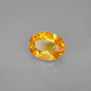 1,68 ctw natürlicher orangefarbener Clinohumit, Oval Schliff, VS-SI