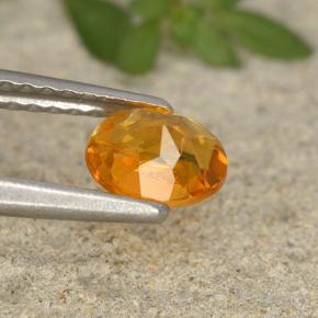 0,62 ctw natürlicher orangefarbener Clinohumit, Oval Schliff, VS-SI