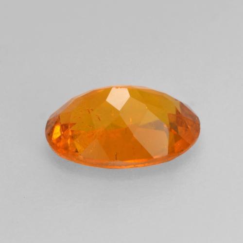 0,82 ctw natürlicher orangefarbener Clinohumit, Oval Schliff, SI