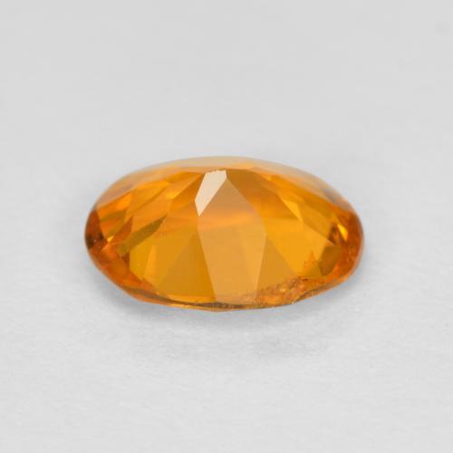 0,68 ctw natürlicher orangefarbener Clinohumit, Oval Schliff, SI