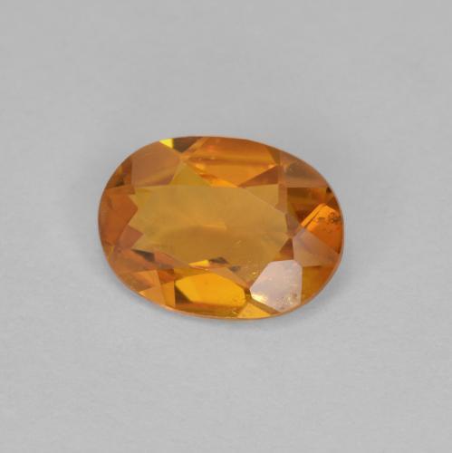 0,90 ctw natürlicher orangefarbener Clinohumit, Oval Schliff, VS-SI