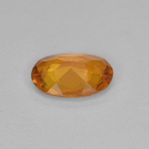 0,90 ctw natürlicher orangefarbener Clinohumit, Oval Schliff, VS-SI