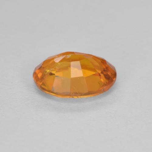 0,91 ctw natürlicher orangefarbener Clinohumit, Oval Schliff, SI