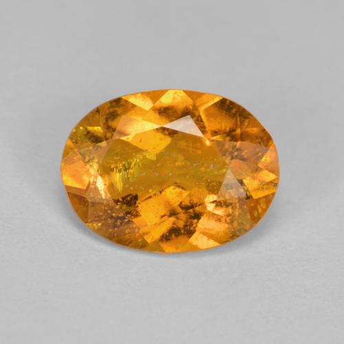 1,43 ctw natürlicher orangefarbener Clinohumit, Oval Schliff, SI
