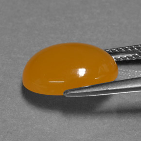 3,93 ctw natürlicher orangefarbener Feueropal, Oval Schliff, Lichtdurchlässig