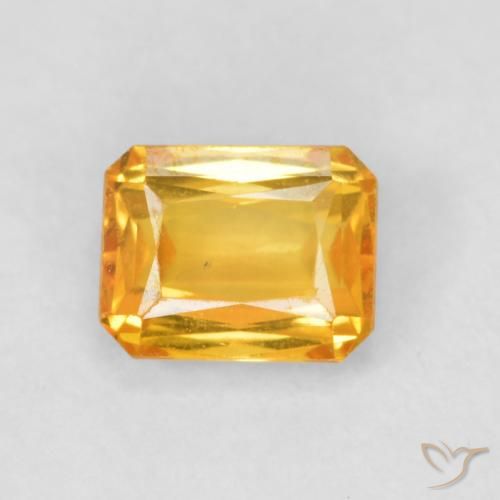 0.66ct Natürlicher Dunkelorange-Gold Saphir, Smaragdschliff, VS