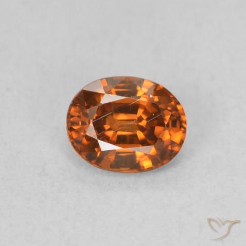 0.60ct Natürlicher tieforange Zirkon, Oval, VS