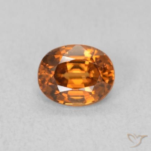 0.67ct Natürlicher tieforange Zirkon, Oval, VVS, Photo A