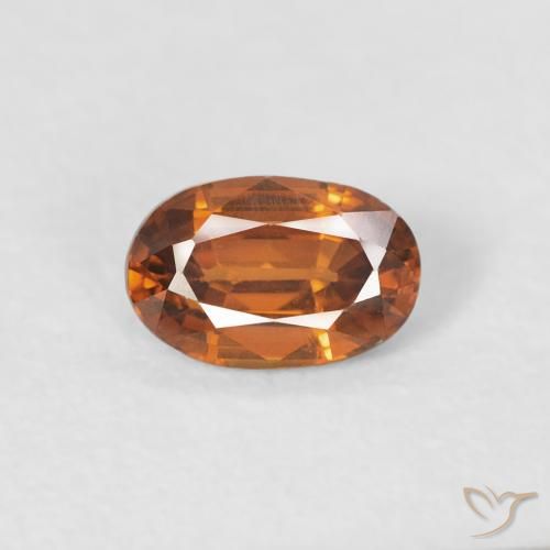 0.68ct Natürlicher Medium Dark-Orange Zirkon, Oval, VVS-VS